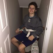Andrew H using stairlift
