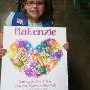 Kenzie with a sign