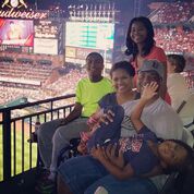 Kiland with his family at a Cardinals baseball game